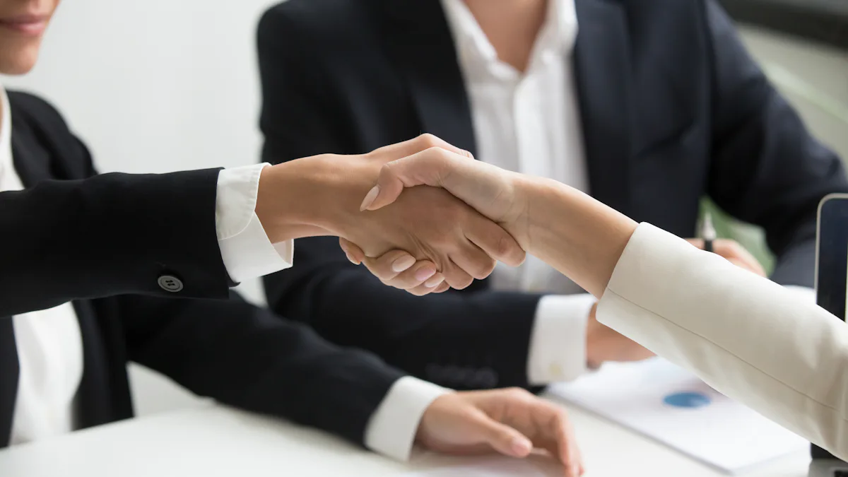 Employer and new hire shaking hands after a job offer