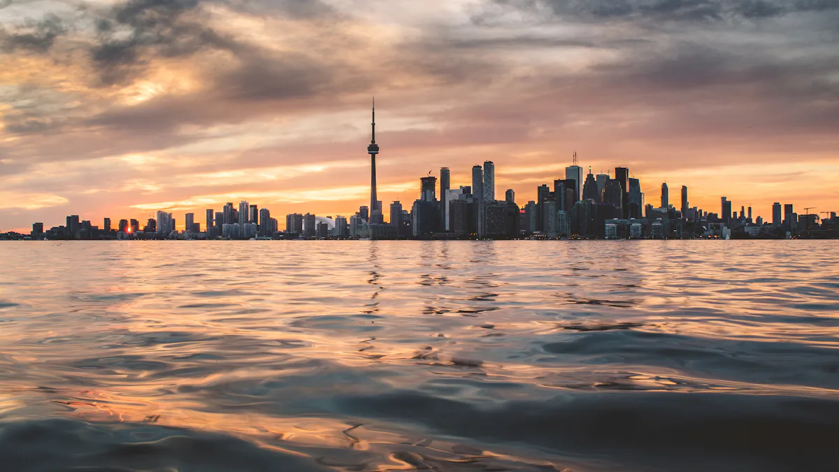 Toronto skyline with the CN Tower across Lake Ontario at golden hour