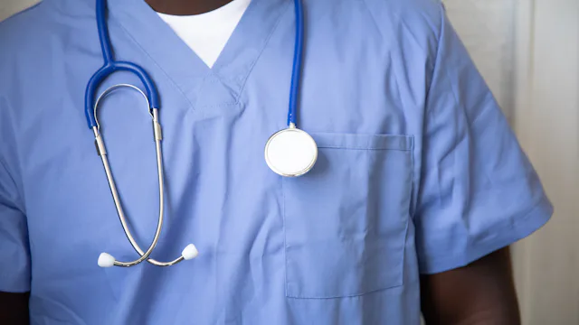 Nurse in blue scrubs with a stethoscope
